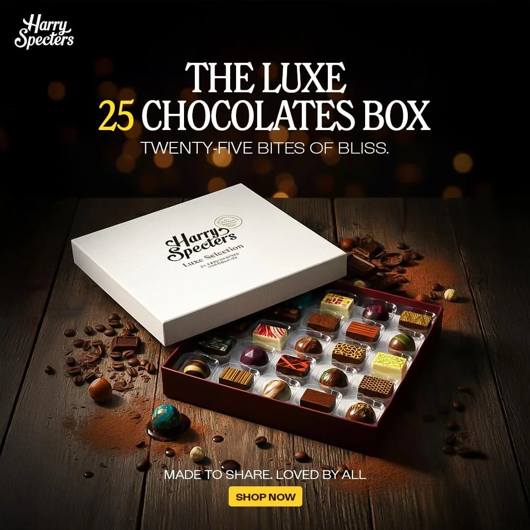 Paid social ad for a luxury boxed chocolate collection, shot on a dark surface